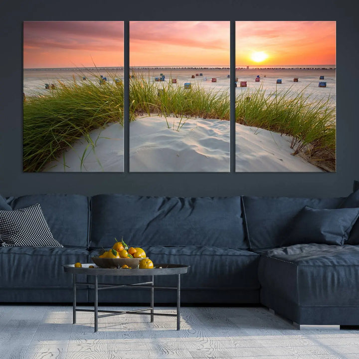 The Ocean Beach Wall Art Canvas Print beautifully captures a sunset over the beach and adds a coastal decor vibe to the space.