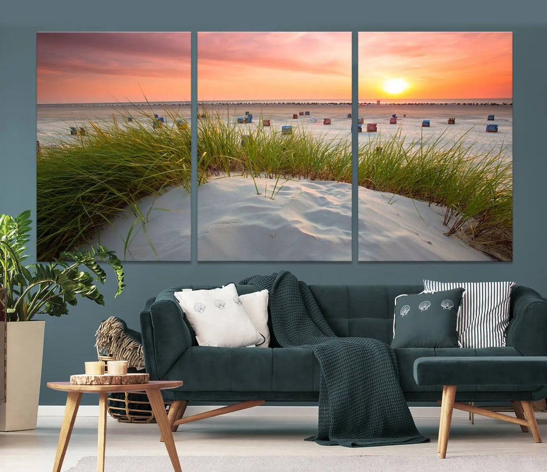 The Ocean Beach Wall Art Canvas Print beautifully captures a sunset over the beach and adds a coastal decor vibe to the space.