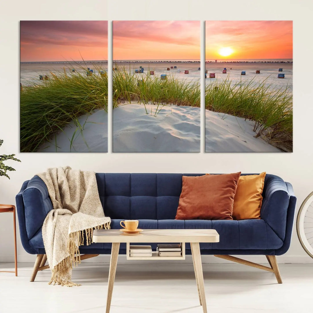 The Ocean Beach Wall Art Canvas Print beautifully captures a sunset over the beach and adds a coastal decor vibe to the space.