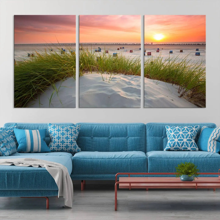 The Ocean Beach Wall Art Canvas Print beautifully captures a sunset over the beach and adds a coastal decor vibe to the space.