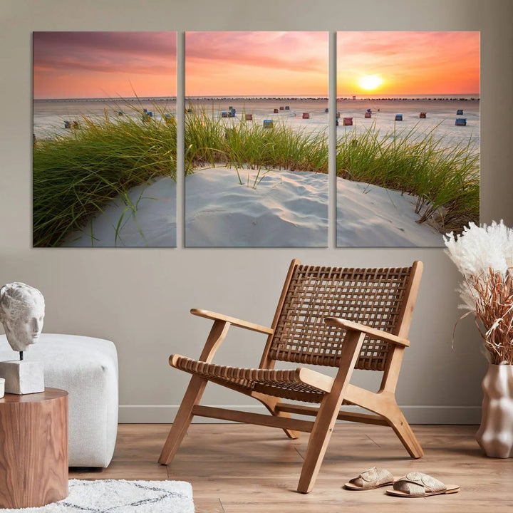 The Ocean Beach Wall Art Canvas Print beautifully captures a sunset over the beach and adds a coastal decor vibe to the space.