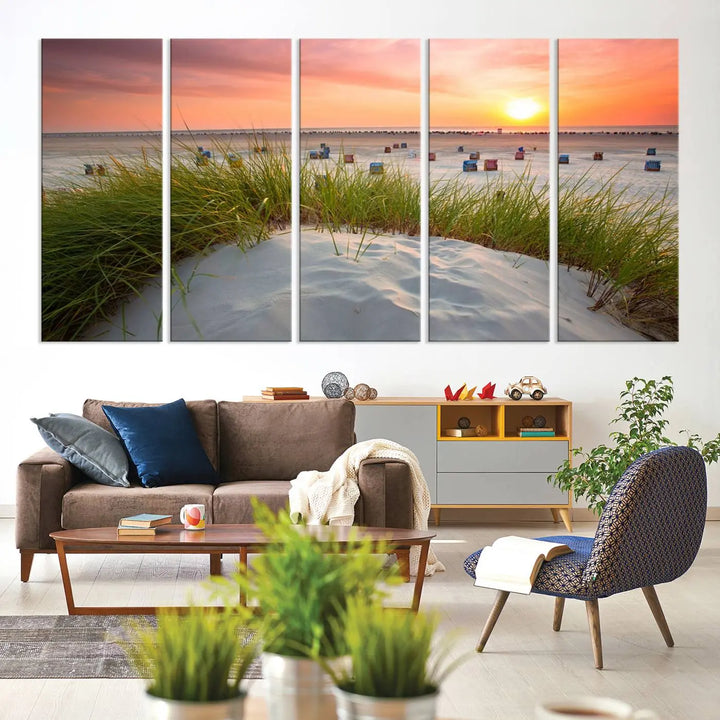 The Ocean Beach Wall Art Canvas Print beautifully captures a sunset over the beach and adds a coastal decor vibe to the space.