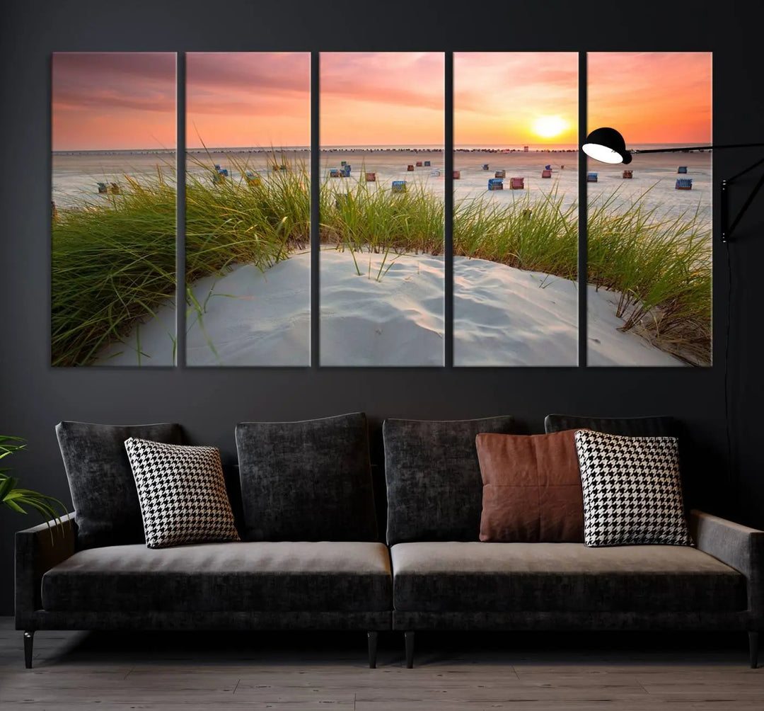 The Ocean Beach Wall Art Canvas Print beautifully captures a sunset over the beach and adds a coastal decor vibe to the space.