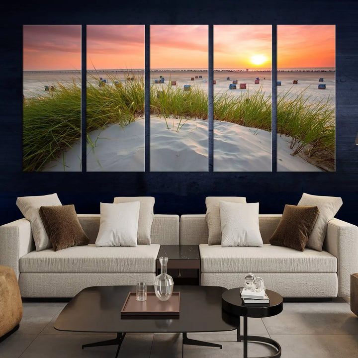 The Ocean Beach Wall Art Canvas Print beautifully captures a sunset over the beach and adds a coastal decor vibe to the space.