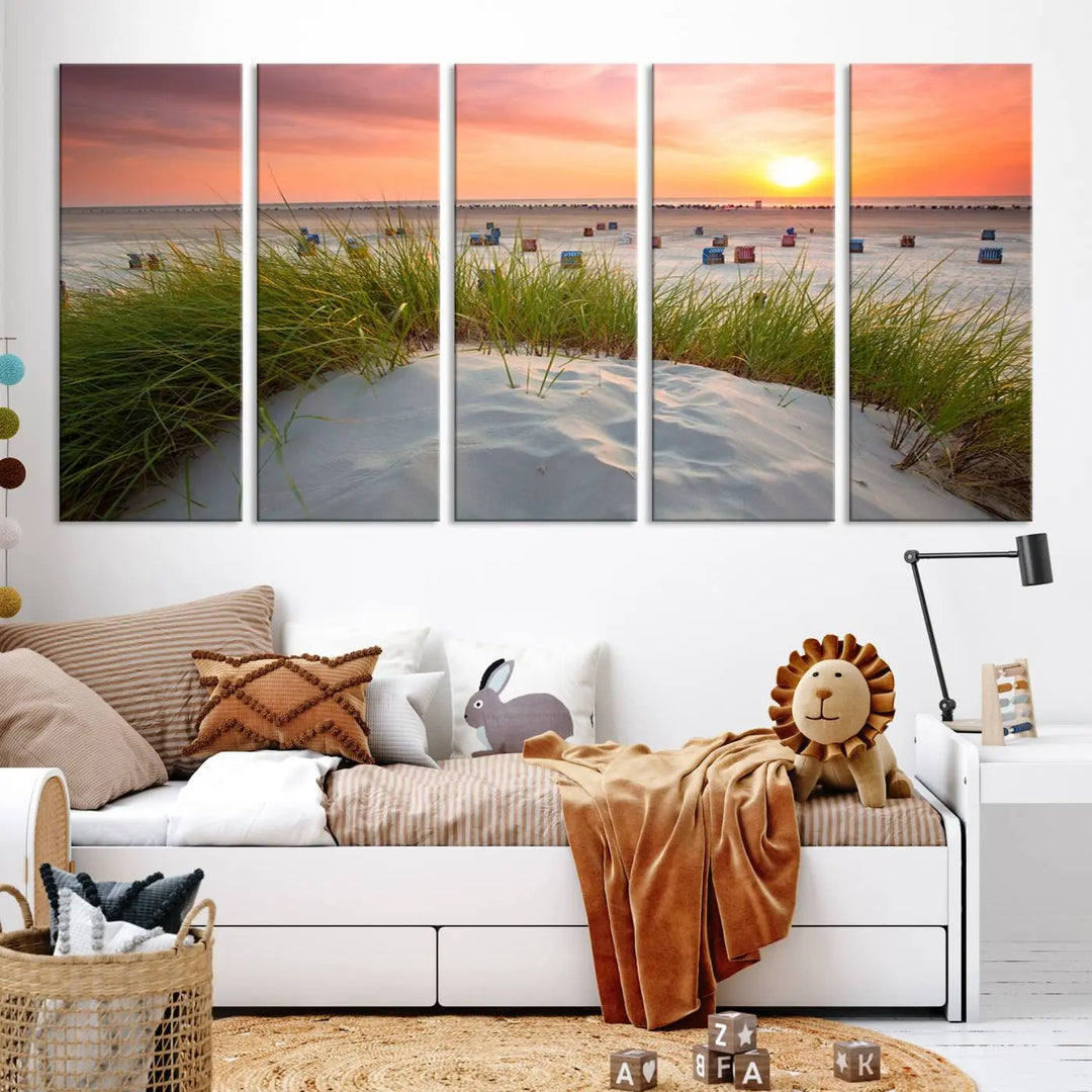 The Ocean Beach Wall Art Canvas Print beautifully captures a sunset over the beach and adds a coastal decor vibe to the space.