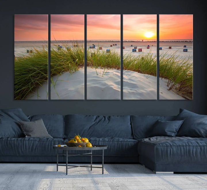 The Ocean Beach Wall Art Canvas Print beautifully captures a sunset over the beach and adds a coastal decor vibe to the space.