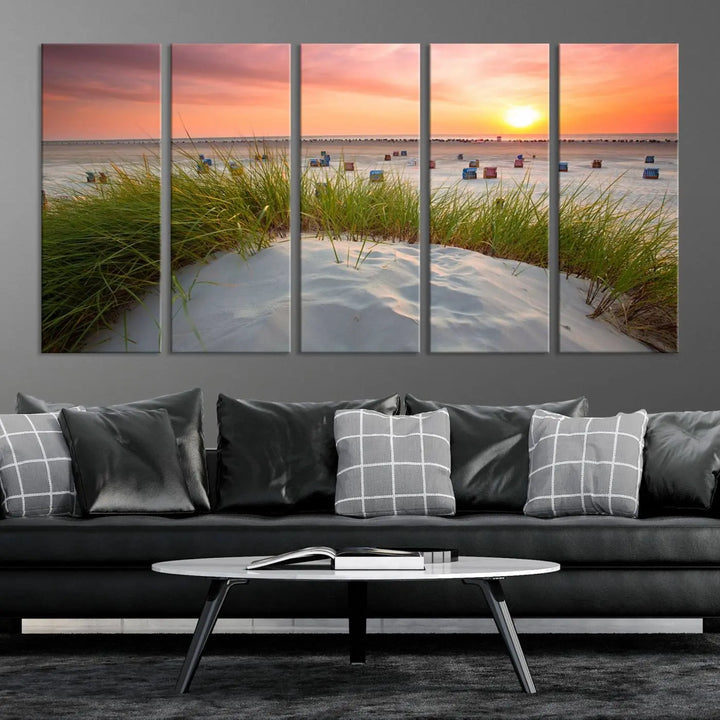 The Ocean Beach Wall Art Canvas Print beautifully captures a sunset over the beach and adds a coastal decor vibe to the space.