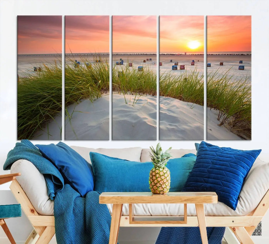 The Ocean Beach Wall Art Canvas Print beautifully captures a sunset over the beach and adds a coastal decor vibe to the space.