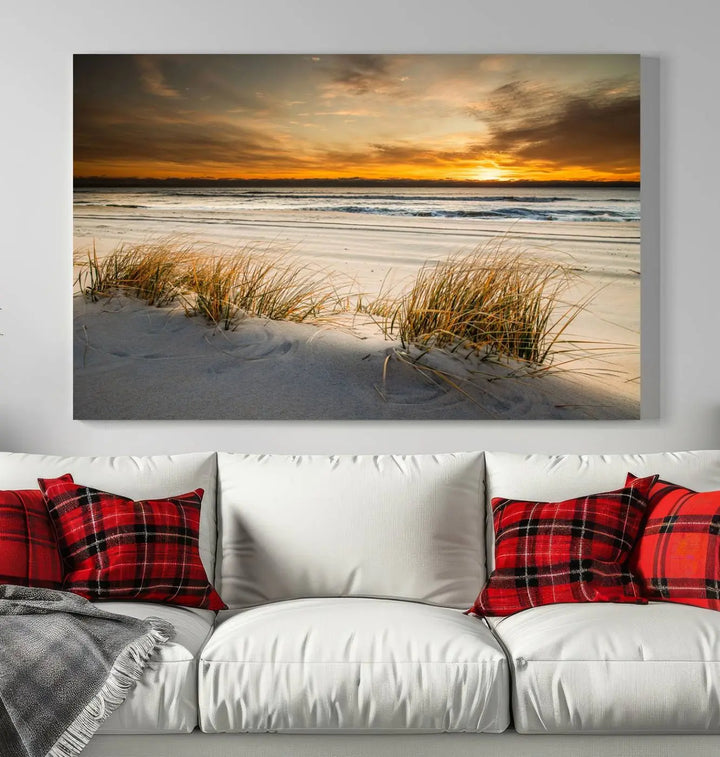 The Ocean Beach Wall Art Canvas Print, a captivating triptych showcasing a sunset over the beach with grass, hangs gracefully. These gallery-wrapped, museum-quality canvases boast a UV-protective coating that preserves their vibrant colors and stunning detail for years to come.