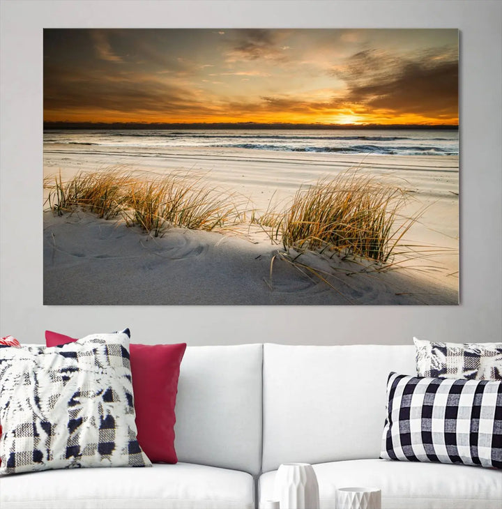 The Ocean Beach Wall Art Canvas Print, a captivating triptych showcasing a sunset over the beach with grass, hangs gracefully. These gallery-wrapped, museum-quality canvases boast a UV-protective coating that preserves their vibrant colors and stunning detail for years to come.