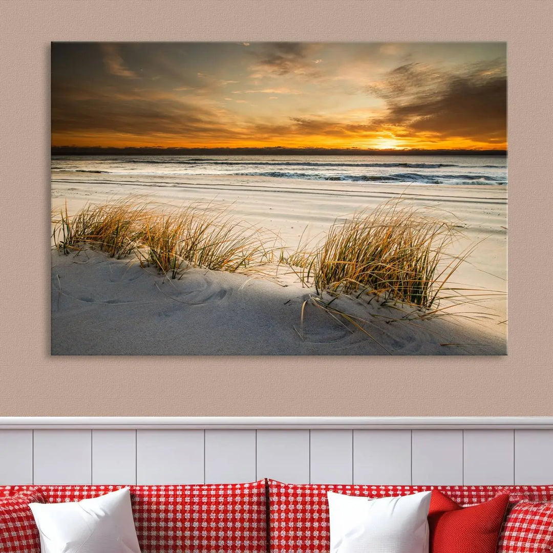 The Ocean Beach Wall Art Canvas Print, a captivating triptych showcasing a sunset over the beach with grass, hangs gracefully. These gallery-wrapped, museum-quality canvases boast a UV-protective coating that preserves their vibrant colors and stunning detail for years to come.