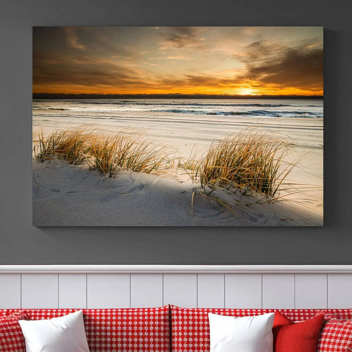 The Ocean Beach Wall Art Canvas Print, a captivating triptych showcasing a sunset over the beach with grass, hangs gracefully. These gallery-wrapped, museum-quality canvases boast a UV-protective coating that preserves their vibrant colors and stunning detail for years to come.