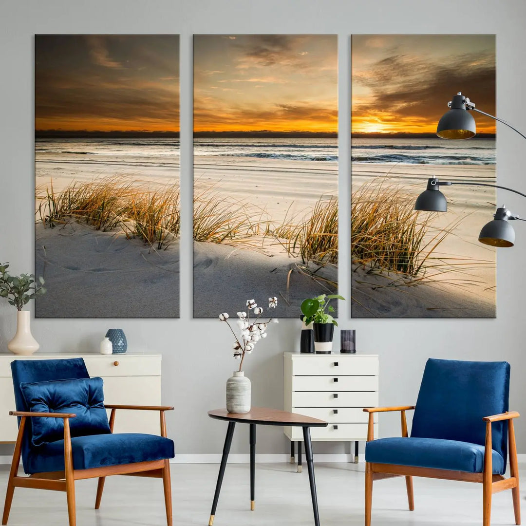 The Ocean Beach Wall Art Canvas Print, a captivating triptych showcasing a sunset over the beach with grass, hangs gracefully. These gallery-wrapped, museum-quality canvases boast a UV-protective coating that preserves their vibrant colors and stunning detail for years to come.