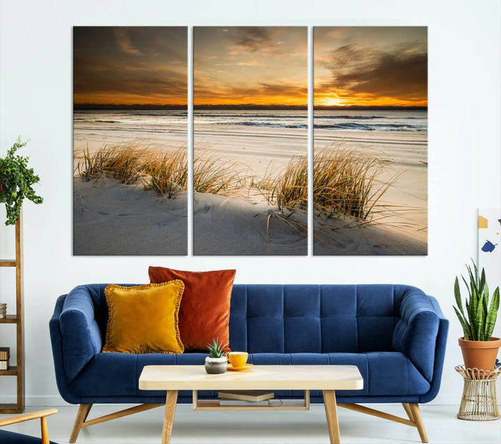 The Ocean Beach Wall Art Canvas Print, a captivating triptych showcasing a sunset over the beach with grass, hangs gracefully. These gallery-wrapped, museum-quality canvases boast a UV-protective coating that preserves their vibrant colors and stunning detail for years to come.