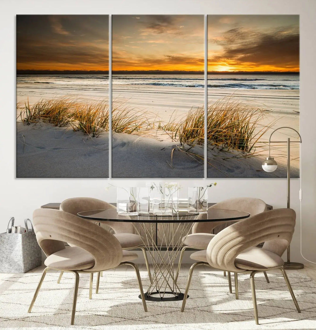 The Ocean Beach Wall Art Canvas Print, a captivating triptych showcasing a sunset over the beach with grass, hangs gracefully. These gallery-wrapped, museum-quality canvases boast a UV-protective coating that preserves their vibrant colors and stunning detail for years to come.