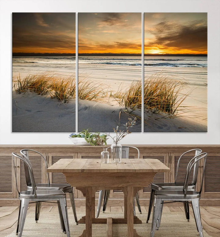 The Ocean Beach Wall Art Canvas Print, a captivating triptych showcasing a sunset over the beach with grass, hangs gracefully. These gallery-wrapped, museum-quality canvases boast a UV-protective coating that preserves their vibrant colors and stunning detail for years to come.