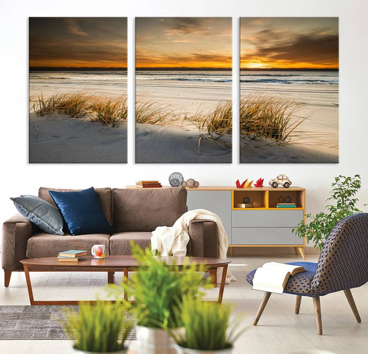 The Ocean Beach Wall Art Canvas Print, a captivating triptych showcasing a sunset over the beach with grass, hangs gracefully. These gallery-wrapped, museum-quality canvases boast a UV-protective coating that preserves their vibrant colors and stunning detail for years to come.