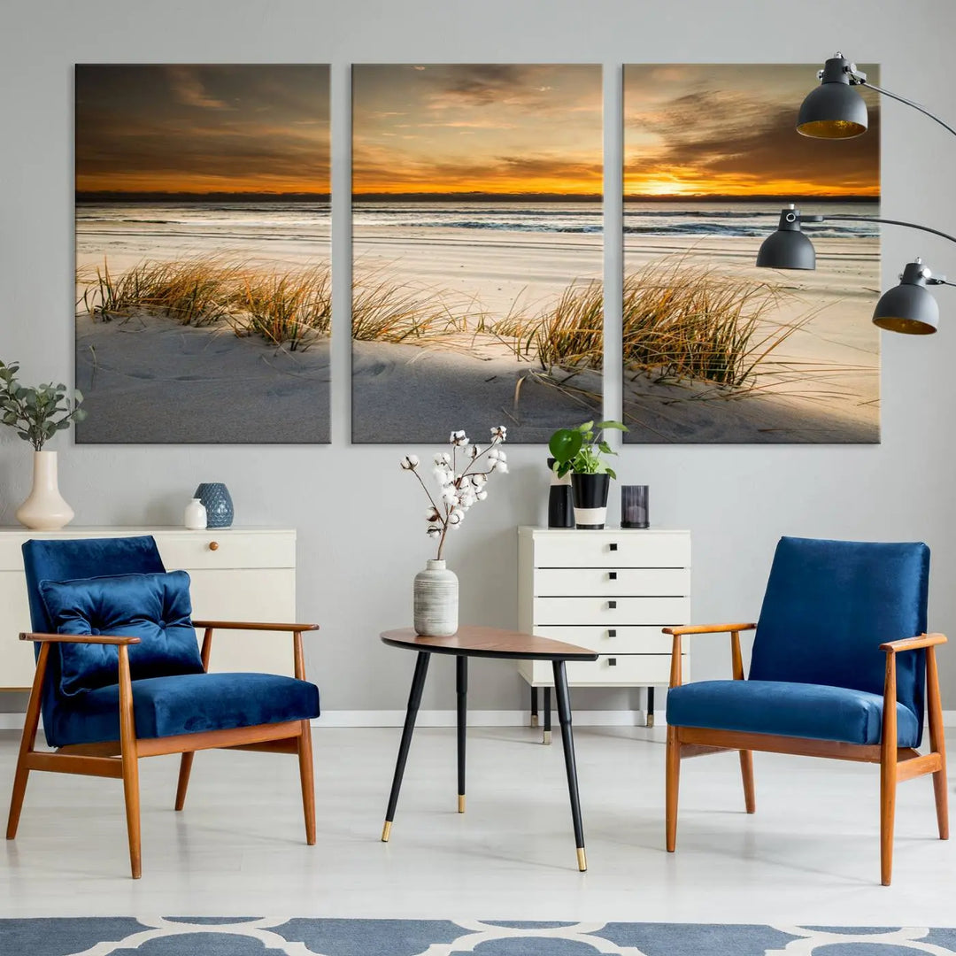 The Ocean Beach Wall Art Canvas Print, a captivating triptych showcasing a sunset over the beach with grass, hangs gracefully. These gallery-wrapped, museum-quality canvases boast a UV-protective coating that preserves their vibrant colors and stunning detail for years to come.