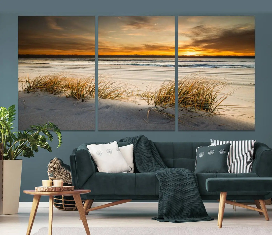 The Ocean Beach Wall Art Canvas Print, a captivating triptych showcasing a sunset over the beach with grass, hangs gracefully. These gallery-wrapped, museum-quality canvases boast a UV-protective coating that preserves their vibrant colors and stunning detail for years to come.