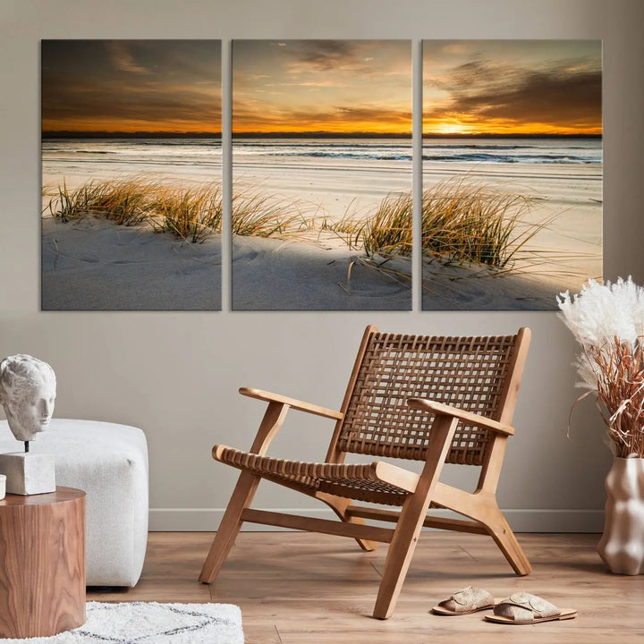 The Ocean Beach Wall Art Canvas Print, a captivating triptych showcasing a sunset over the beach with grass, hangs gracefully. These gallery-wrapped, museum-quality canvases boast a UV-protective coating that preserves their vibrant colors and stunning detail for years to come.