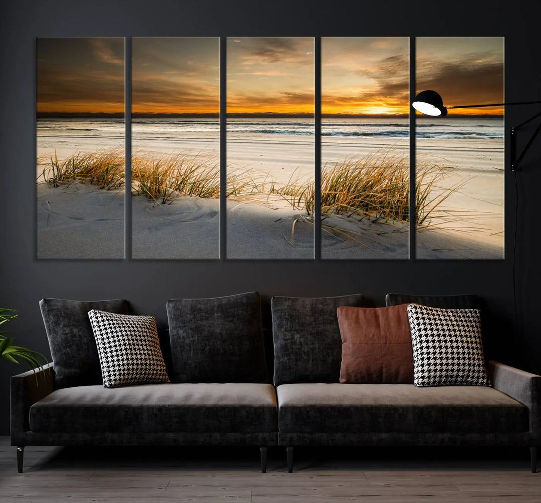 The Ocean Beach Wall Art Canvas Print, a captivating triptych showcasing a sunset over the beach with grass, hangs gracefully. These gallery-wrapped, museum-quality canvases boast a UV-protective coating that preserves their vibrant colors and stunning detail for years to come.