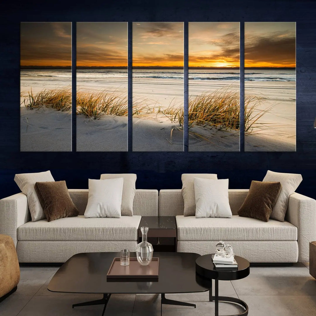 The Ocean Beach Wall Art Canvas Print, a captivating triptych showcasing a sunset over the beach with grass, hangs gracefully. These gallery-wrapped, museum-quality canvases boast a UV-protective coating that preserves their vibrant colors and stunning detail for years to come.