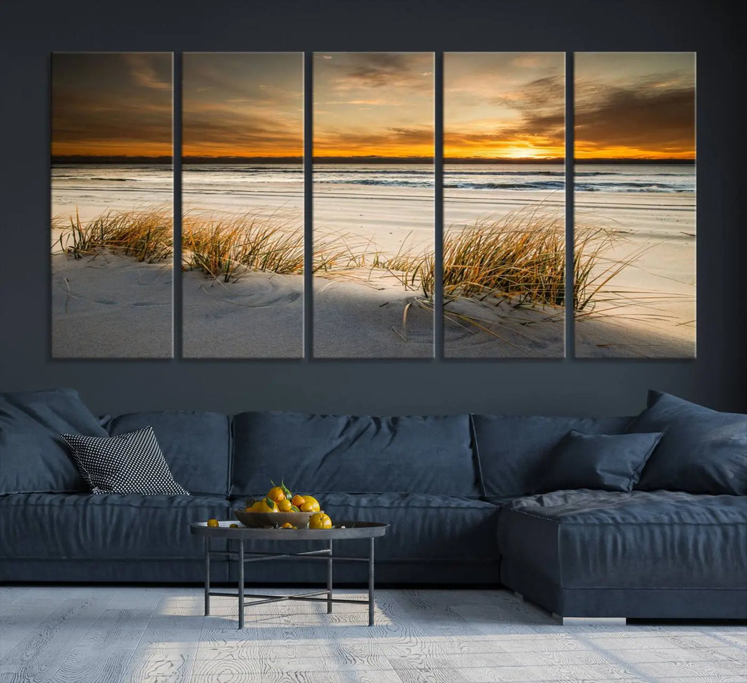 The Ocean Beach Wall Art Canvas Print, a captivating triptych showcasing a sunset over the beach with grass, hangs gracefully. These gallery-wrapped, museum-quality canvases boast a UV-protective coating that preserves their vibrant colors and stunning detail for years to come.