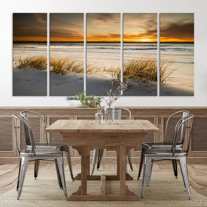 The Ocean Beach Wall Art Canvas Print, a captivating triptych showcasing a sunset over the beach with grass, hangs gracefully. These gallery-wrapped, museum-quality canvases boast a UV-protective coating that preserves their vibrant colors and stunning detail for years to come.