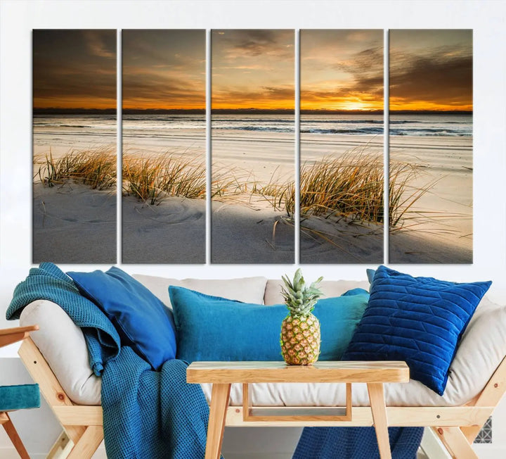 The Ocean Beach Wall Art Canvas Print, a captivating triptych showcasing a sunset over the beach with grass, hangs gracefully. These gallery-wrapped, museum-quality canvases boast a UV-protective coating that preserves their vibrant colors and stunning detail for years to come.