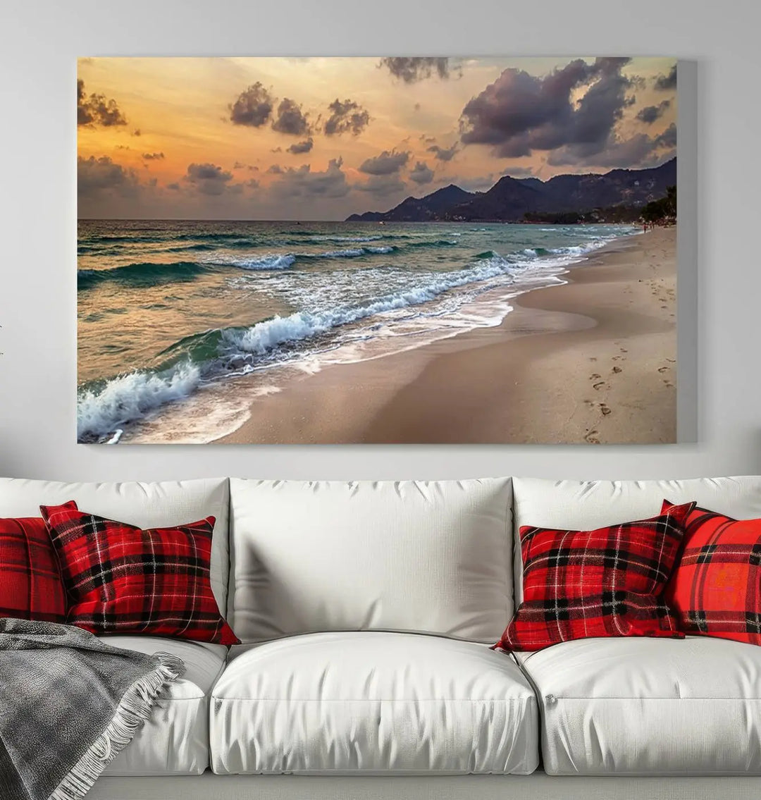 The Ocean Beach Wall Art Canvas Print, a stunning triptych featuring sunset artwork that captures waves and footprints on the sand, beautifully enhances any coastal decor.