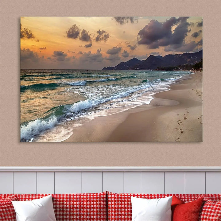 The Ocean Beach Wall Art Canvas Print, a stunning triptych featuring sunset artwork that captures waves and footprints on the sand, beautifully enhances any coastal decor.