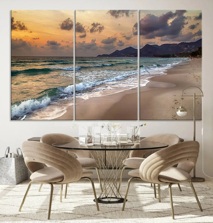 The Ocean Beach Wall Art Canvas Print, a stunning triptych featuring sunset artwork that captures waves and footprints on the sand, beautifully enhances any coastal decor.