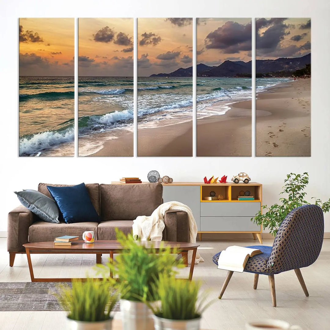 The Ocean Beach Wall Art Canvas Print, a stunning triptych featuring sunset artwork that captures waves and footprints on the sand, beautifully enhances any coastal decor.