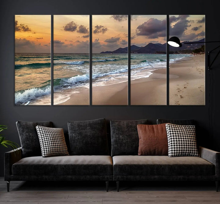 The Ocean Beach Wall Art Canvas Print, a stunning triptych featuring sunset artwork that captures waves and footprints on the sand, beautifully enhances any coastal decor.