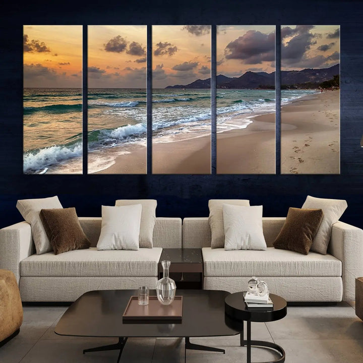 The Ocean Beach Wall Art Canvas Print, a stunning triptych featuring sunset artwork that captures waves and footprints on the sand, beautifully enhances any coastal decor.