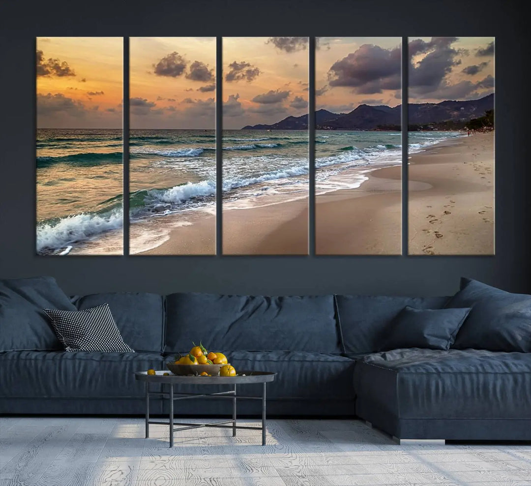 The Ocean Beach Wall Art Canvas Print, a stunning triptych featuring sunset artwork that captures waves and footprints on the sand, beautifully enhances any coastal decor.