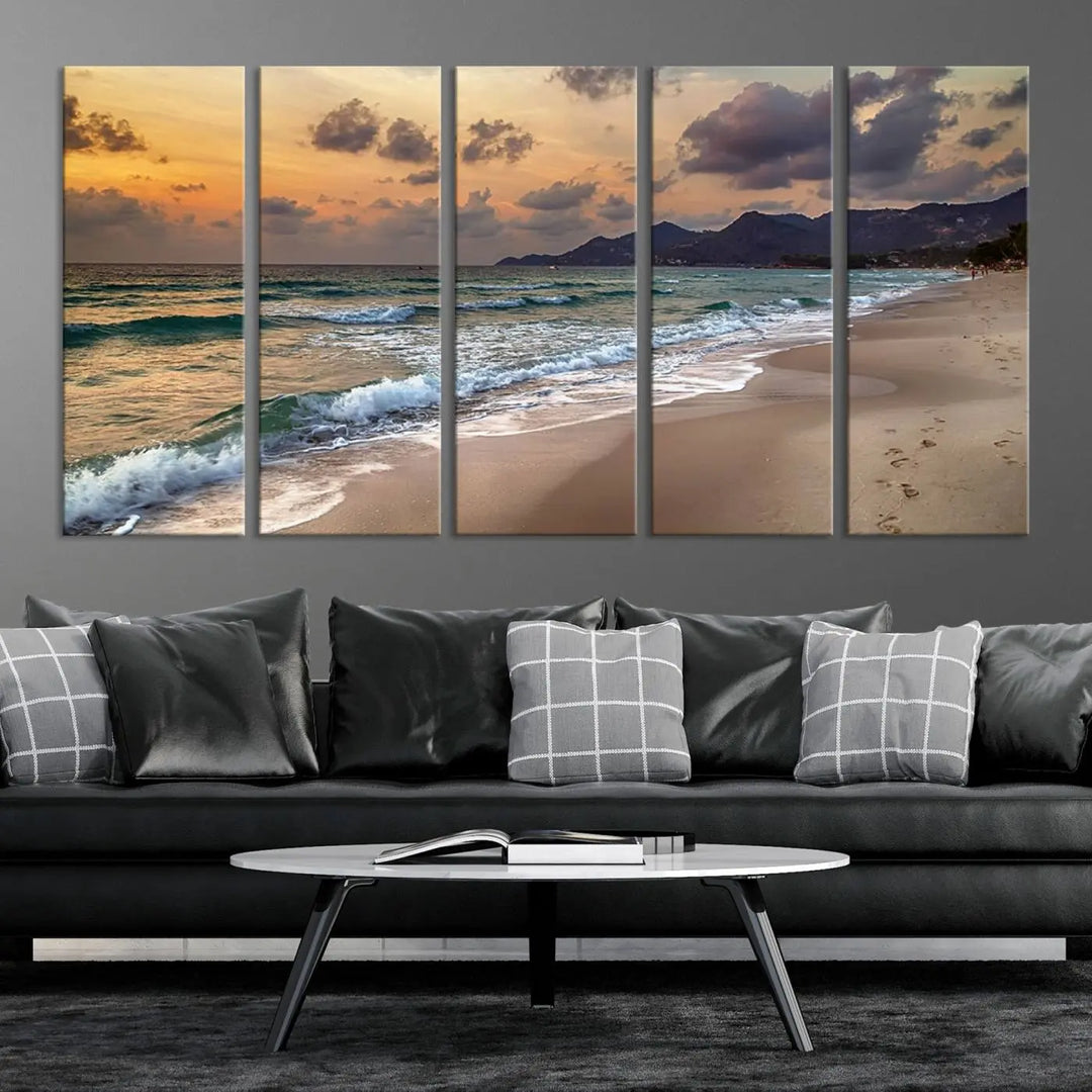 The Ocean Beach Wall Art Canvas Print, a stunning triptych featuring sunset artwork that captures waves and footprints on the sand, beautifully enhances any coastal decor.