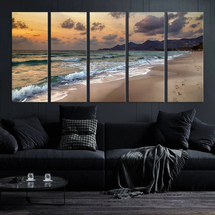 The Ocean Beach Wall Art Canvas Print, a stunning triptych featuring sunset artwork that captures waves and footprints on the sand, beautifully enhances any coastal decor.