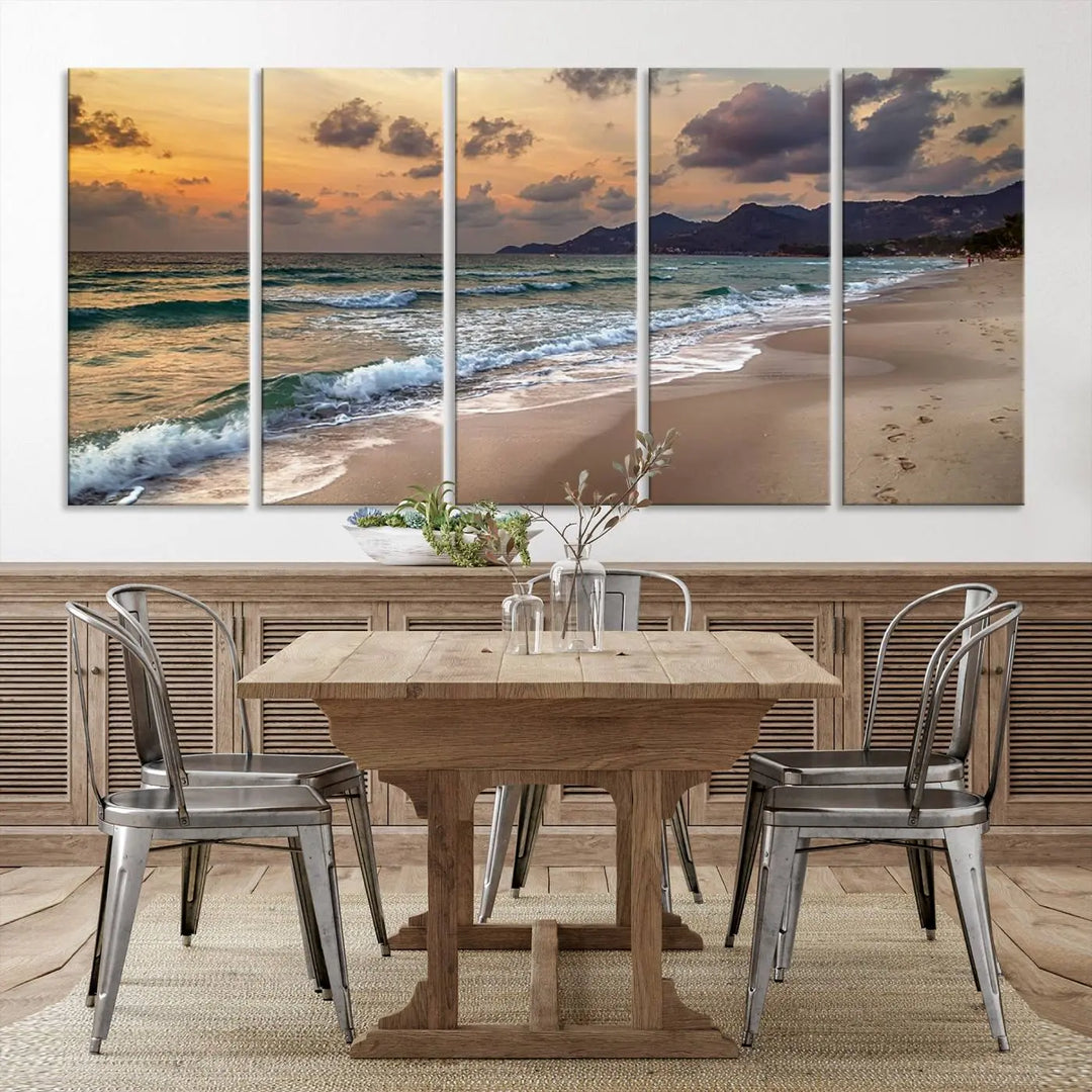 The Ocean Beach Wall Art Canvas Print, a stunning triptych featuring sunset artwork that captures waves and footprints on the sand, beautifully enhances any coastal decor.