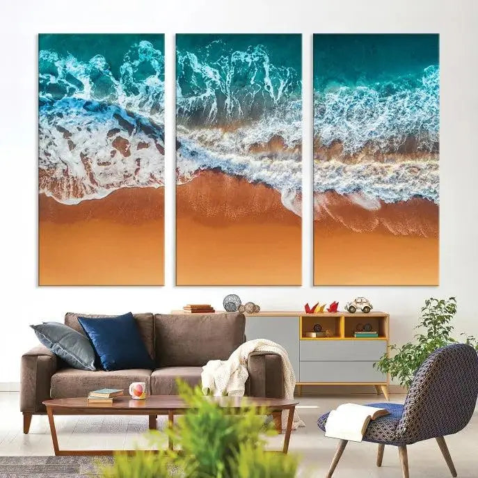 The "Ocean Beach Wall Art Nautical Landscape Canvas Print" is a stunning triptych of aerial ocean waves on museum-quality canvas with UV-protective coating. It's ready to hang and can instantly transform your space.