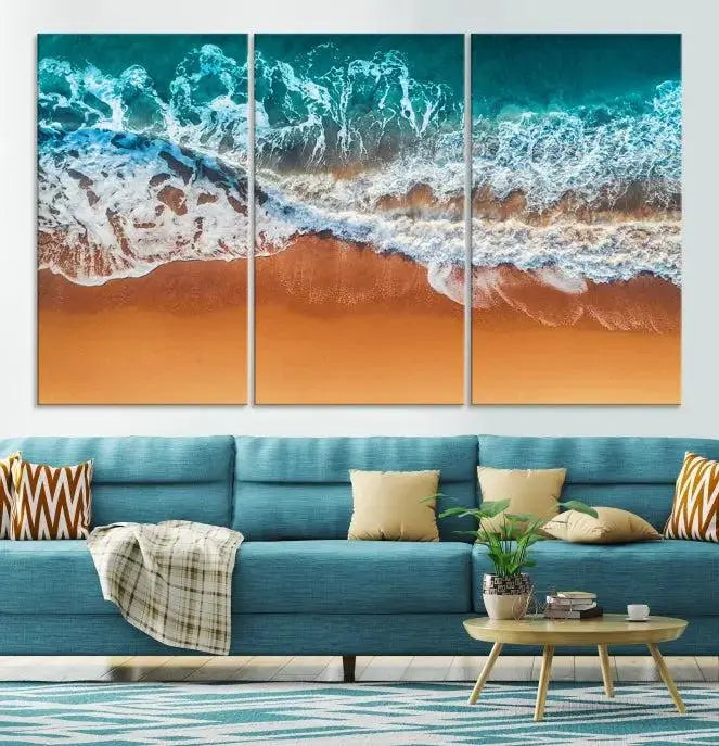 The "Ocean Beach Wall Art Nautical Landscape Canvas Print" is a stunning triptych of aerial ocean waves on museum-quality canvas with UV-protective coating. It's ready to hang and can instantly transform your space.