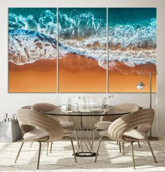 The "Ocean Beach Wall Art Nautical Landscape Canvas Print" is a stunning triptych of aerial ocean waves on museum-quality canvas with UV-protective coating. It's ready to hang and can instantly transform your space.