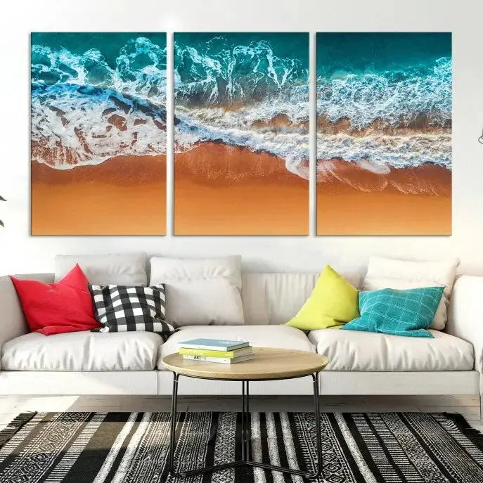 The "Ocean Beach Wall Art Nautical Landscape Canvas Print" is a stunning triptych of aerial ocean waves on museum-quality canvas with UV-protective coating. It's ready to hang and can instantly transform your space.