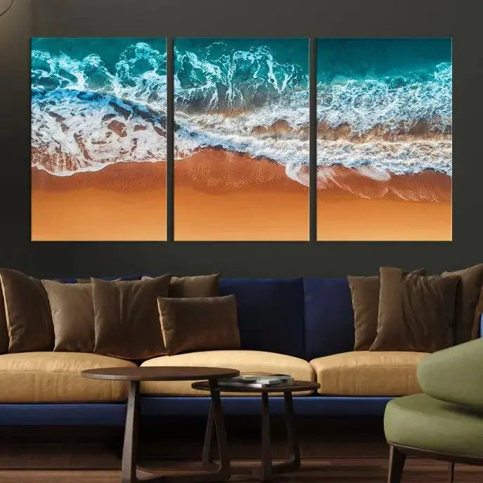 The "Ocean Beach Wall Art Nautical Landscape Canvas Print" is a stunning triptych of aerial ocean waves on museum-quality canvas with UV-protective coating. It's ready to hang and can instantly transform your space.