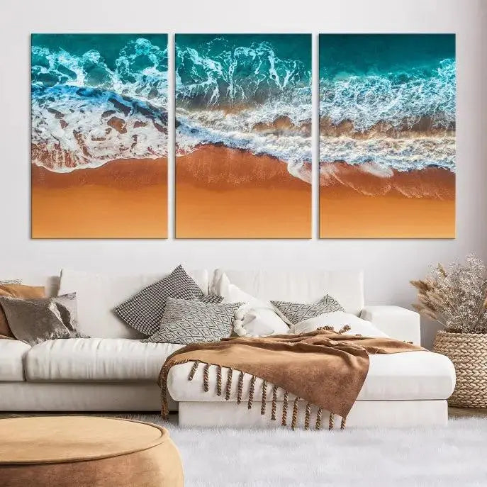 The "Ocean Beach Wall Art Nautical Landscape Canvas Print" is a stunning triptych of aerial ocean waves on museum-quality canvas with UV-protective coating. It's ready to hang and can instantly transform your space.