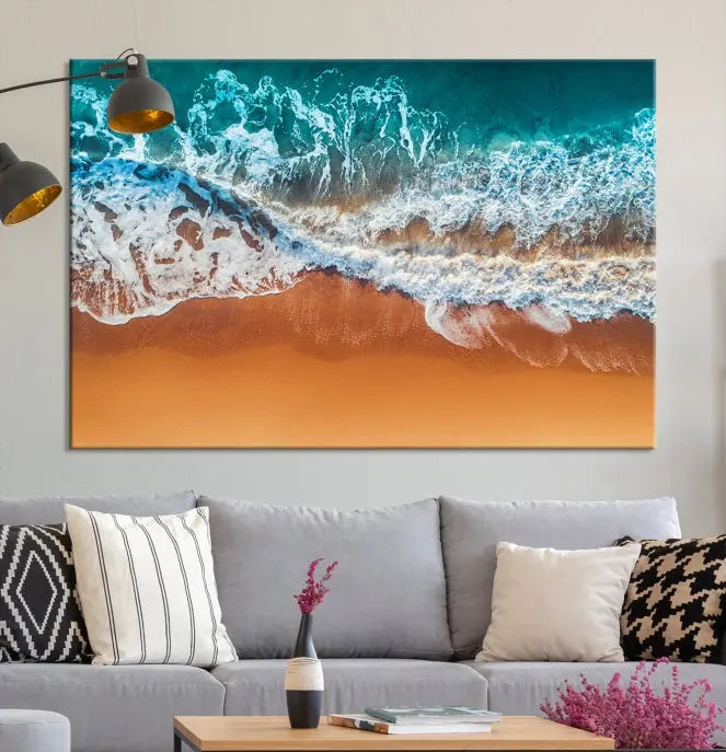 The "Ocean Beach Wall Art Nautical Landscape Canvas Print" is a stunning triptych of aerial ocean waves on museum-quality canvas with UV-protective coating. It's ready to hang and can instantly transform your space.