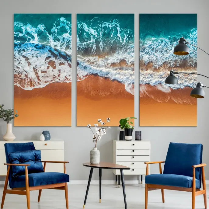 The "Ocean Beach Wall Art Nautical Landscape Canvas Print" is a stunning triptych of aerial ocean waves on museum-quality canvas with UV-protective coating. It's ready to hang and can instantly transform your space.