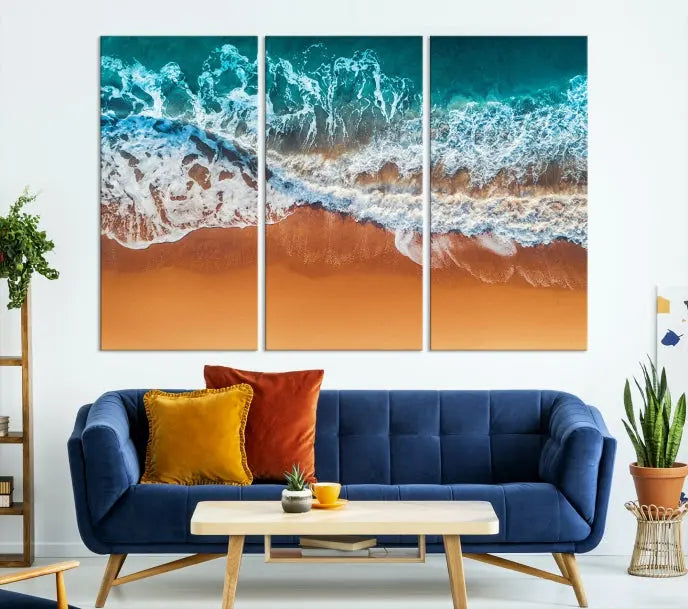 The "Ocean Beach Wall Art Nautical Landscape Canvas Print" is a stunning triptych of aerial ocean waves on museum-quality canvas with UV-protective coating. It's ready to hang and can instantly transform your space.