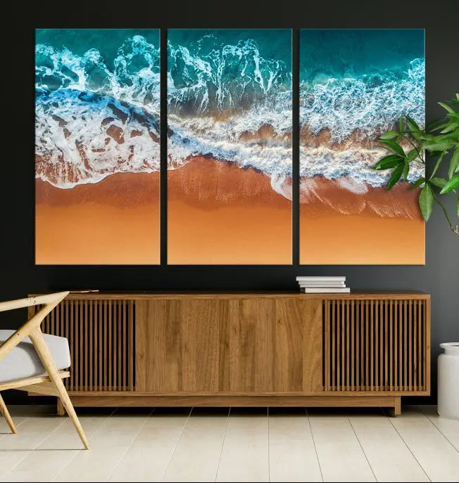 The "Ocean Beach Wall Art Nautical Landscape Canvas Print" is a stunning triptych of aerial ocean waves on museum-quality canvas with UV-protective coating. It's ready to hang and can instantly transform your space.