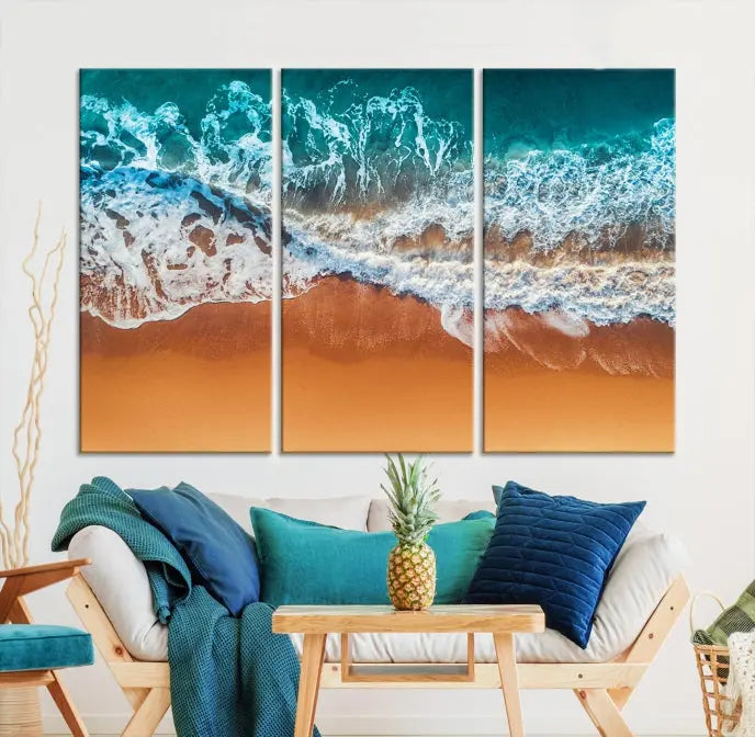 The "Ocean Beach Wall Art Nautical Landscape Canvas Print" is a stunning triptych of aerial ocean waves on museum-quality canvas with UV-protective coating. It's ready to hang and can instantly transform your space.